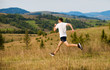 © Svetlana - Running fitness man sprinting outdoors with beautiful mountains landscape on background. Caucasian sport male runner training for marathon.