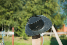 Cowboy Hat On The Ranch. The Fence On The Farm.