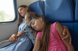 Asleep mom and daughters fell asleep in an electric train car