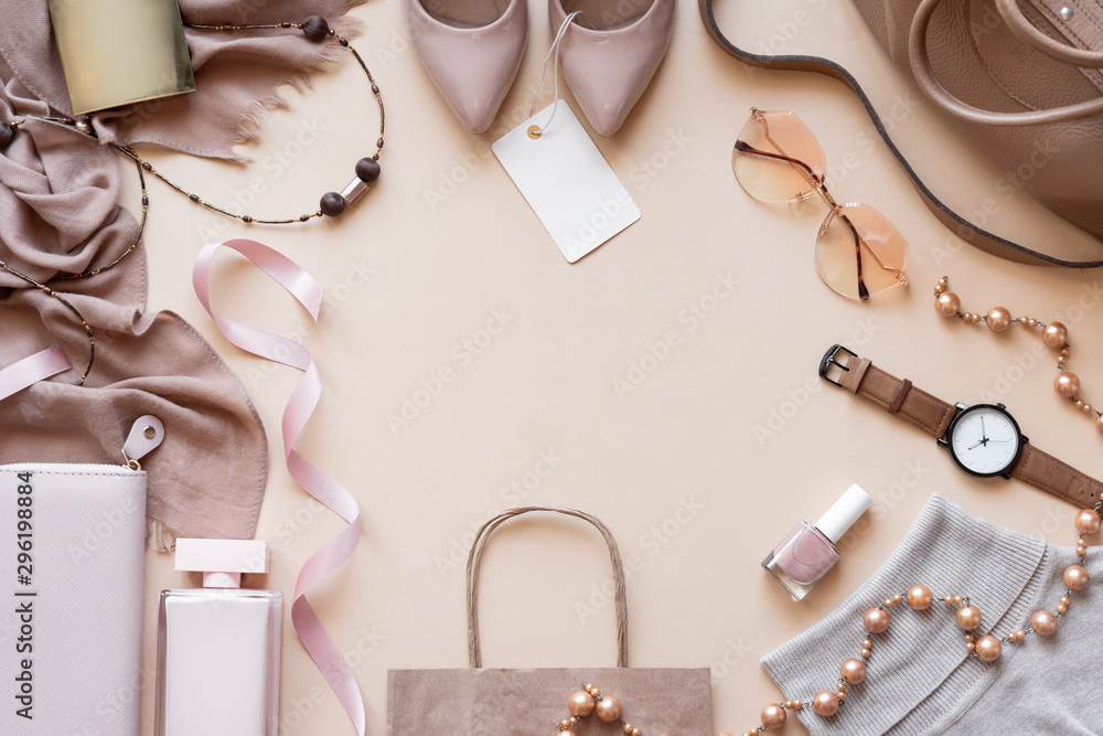 Fashion women stylish accessories outfit glamour set with label flat lay beige pastel background table with copy mock up space, female clothing offers shopping sale concept, above top view close up - obrazy, fototapety, plakaty 