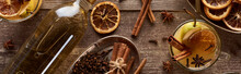 Top View Of Warm Pear Mulled Wine With Spices And Dried Citrus On Wooden Table, Panoramic Shot