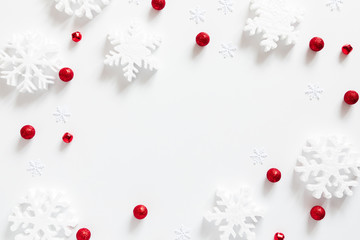 Wall Mural - christmas holiday composition. white snowflakes, xmas red decorations on white background. christmas