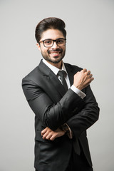 Wall Mural - Portrait of Indian Male businessman standing over white background