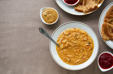 Wall Mural - Pea soup and pancakes with lingonberry sauce