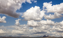 Cumulus Clouds Drifting Across Arizona Like Fluffy White Cotton Balls