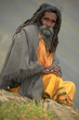 Indian monk sadhu at meditation in mountains