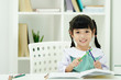 © Asada - Happy student kid girl enjoy learning at school.  Education concept