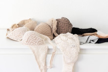 Sexy Women's Panties And Bras On White Table. Female Underwear Background For  Fashion Blogging. Copy Space