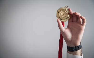 Wall Mural - Businessman with gold medal. Medal awards for winner