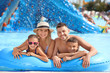 © Pixel-Shot - Happy family resting in aqua park