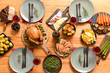 © Pixel-Shot - Table set for big family dinner, top view