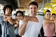 © NDABCREATIVITY - Beautiful fit people exercising together in gym