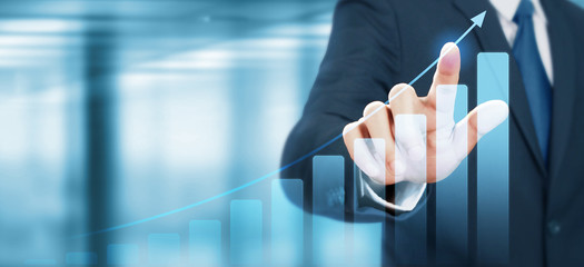 Businessman plan graph growth increase of chart positive indicators in his business