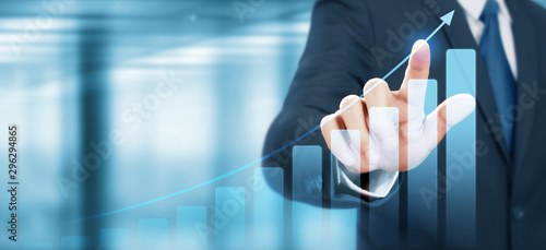 Cuadros en Lienzo Businessman plan graph growth increase of chart positive indicators in his busin