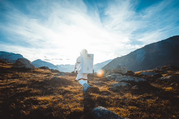 Wall Mural - astronaut exploring a new planet. searching for a new home for humanity. concept about science and n