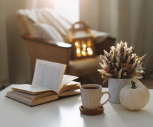 Autumn Still Life. Coffee Cup, Flowers, Book And Pumpkin. Hygge Lifestyle, Cozy Autumn Mood. Flat Lay, Happy Thanksgiving 