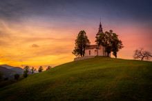 Colorful Sunset Over Mountains With Church On The Hill In Slovenia