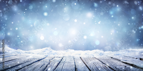 Fotomural Winter Table - Snowy Plank With Snowfall In The Cold Sky