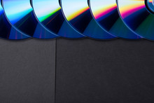 Many Musical Compact Discs With A Rainbow Spectrum Of Colors As A Bright Background