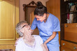 © Miguel Tamayo  - Happy Senior woman laughing. with her caregiver at home. Senior home care concept.