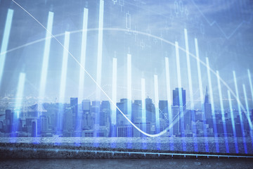 Forex graph on city view with skyscrapers background multi exposure. Financial analysis concept.