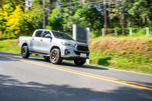 Blurry Speedy Movement Of Pickup Truck Driving On Road