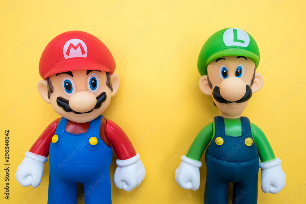 LONDON - JULY 31, 2019: Super Mario Luigi Nintendo video game character on yellow background