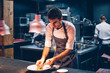 © Jes˙s Martinez/Westend61 - Chef serving food on a plate in the kitchen, of a restaurant