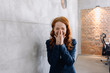 © Kniel Synnatzschke/Westend61 - Laughing redheaded businesswoman in office
