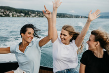 Happy Female, Friends Having Fun On A Boat Trip On A Lake