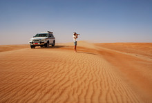 Man Taking Pictures In The Desert, Next To Off-road Vehicle, Wahiba Sands, Oman