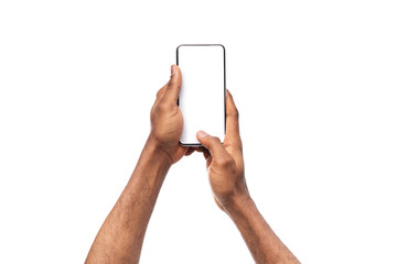 Fototapete - Black man's hands holding cellphone with blank screen, taking photo
