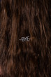 © Christopher Michael - Close up of long brown hair with bye hairpin
