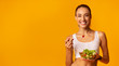 Lady Eating Vegetable Salad From Bowl Standing, Studio Shot, Panorama