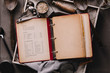 © Ryan Figard - Directly above view of recipe book and utensils