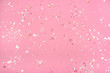 Leinwandbild Motiv Pearl confetti on pink background.