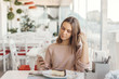 © Alena Ozerova - Teen girl using smart phone in cafe