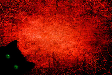 Fototapeta halloween black bloody red background with black cat with green eyes, silhouettes of spider webs. mixed media.