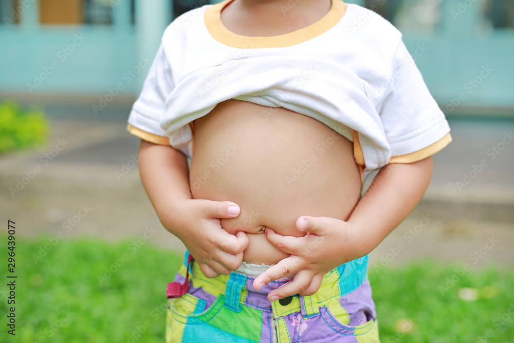 Close Up Little Boy With Stomach Ache Child Holding Hands On His Belly close-up-little-boy-with-stomach-ache-child-holding-hands-on-his-belly