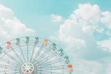 Retro Pastel Colorful Ferris Wheel Of The Amusement Park In The Blue Sky  And Cloud Background.