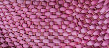 Background Texture Of  Close Up Handcraft Weaving Purple Rattan Bag.