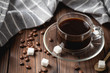 black coffee cup on wooden table.