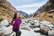 Beautiful woman in her 40s trekking alone in Indian Himalayas