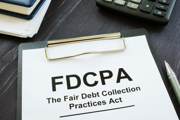 writing note shows the text fdcpa the fair debt collection practices act