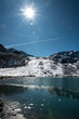 half frozen lake on Lais da Macun
