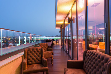interior of a rooftop hotel bar restaurant terrace