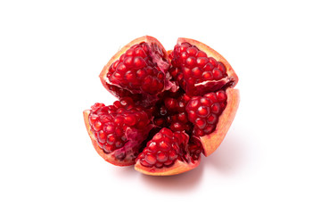 Red Pomegranate, ripped and isolated on white background. 