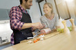 © goodluz - young couple preparing a meal in the kitchen
