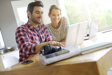 two young colleagues working in an office