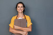 © Rido - Woman entrepreneur in apron looking at camera